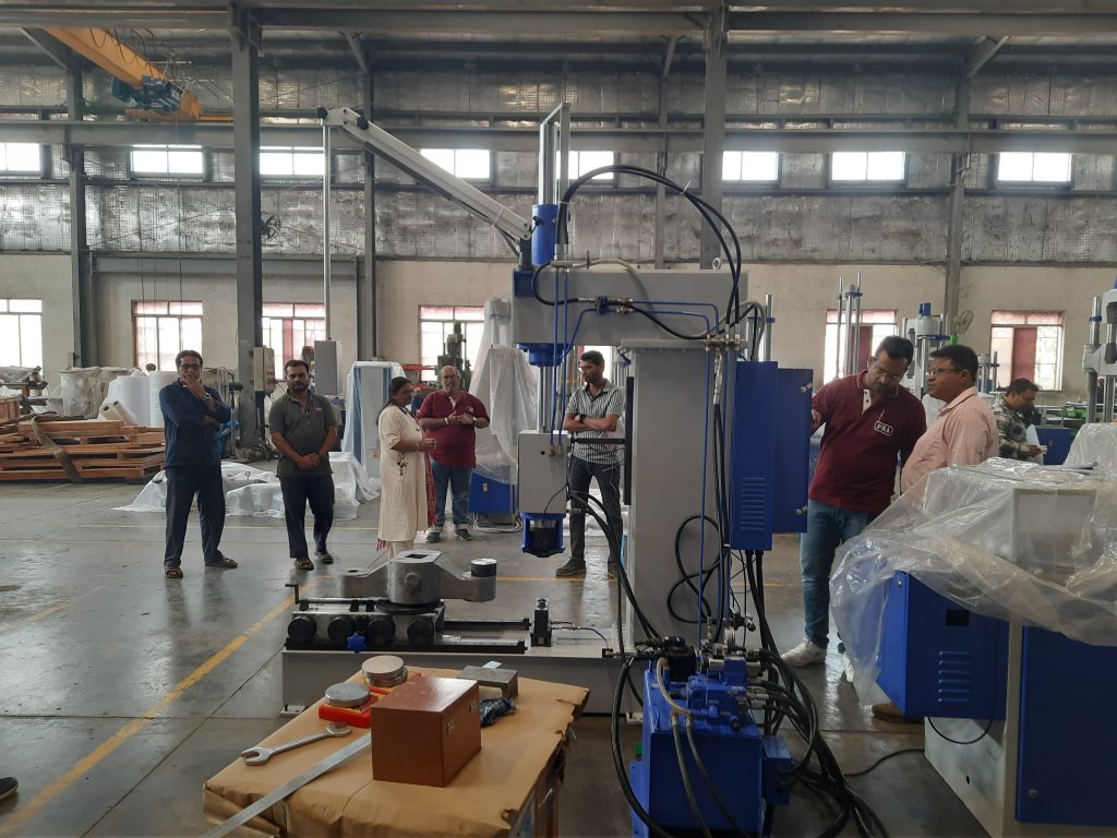 fsa factory machine inspection for indian railways testwin md engineers The Managing Director of TESTWIN, with FSA engineers, inspects a material testing machine at the FSA factory before delivery to Indian Railways.